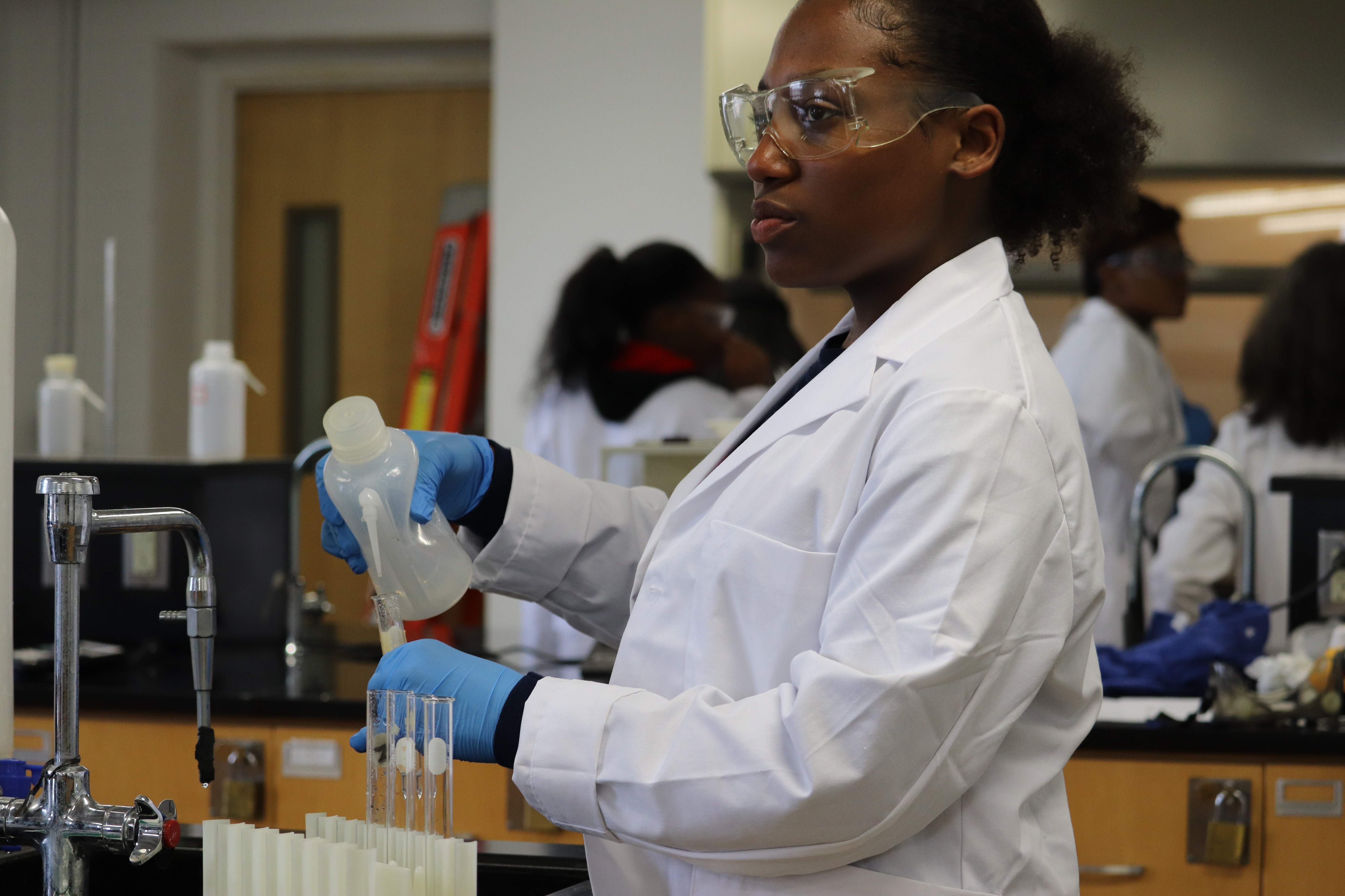 Research Student conducting an experiment in Chemistry Lab