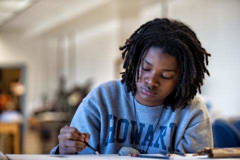 Student at table studying alone