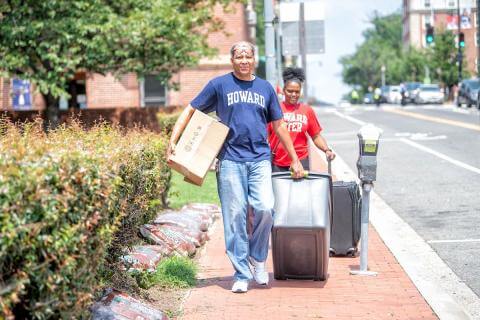 Parent helping student move into dorms