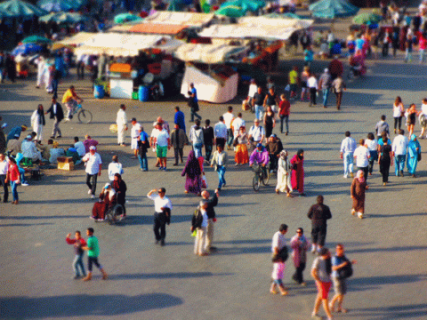 Aerial view of people wanting the city streets of a rural area